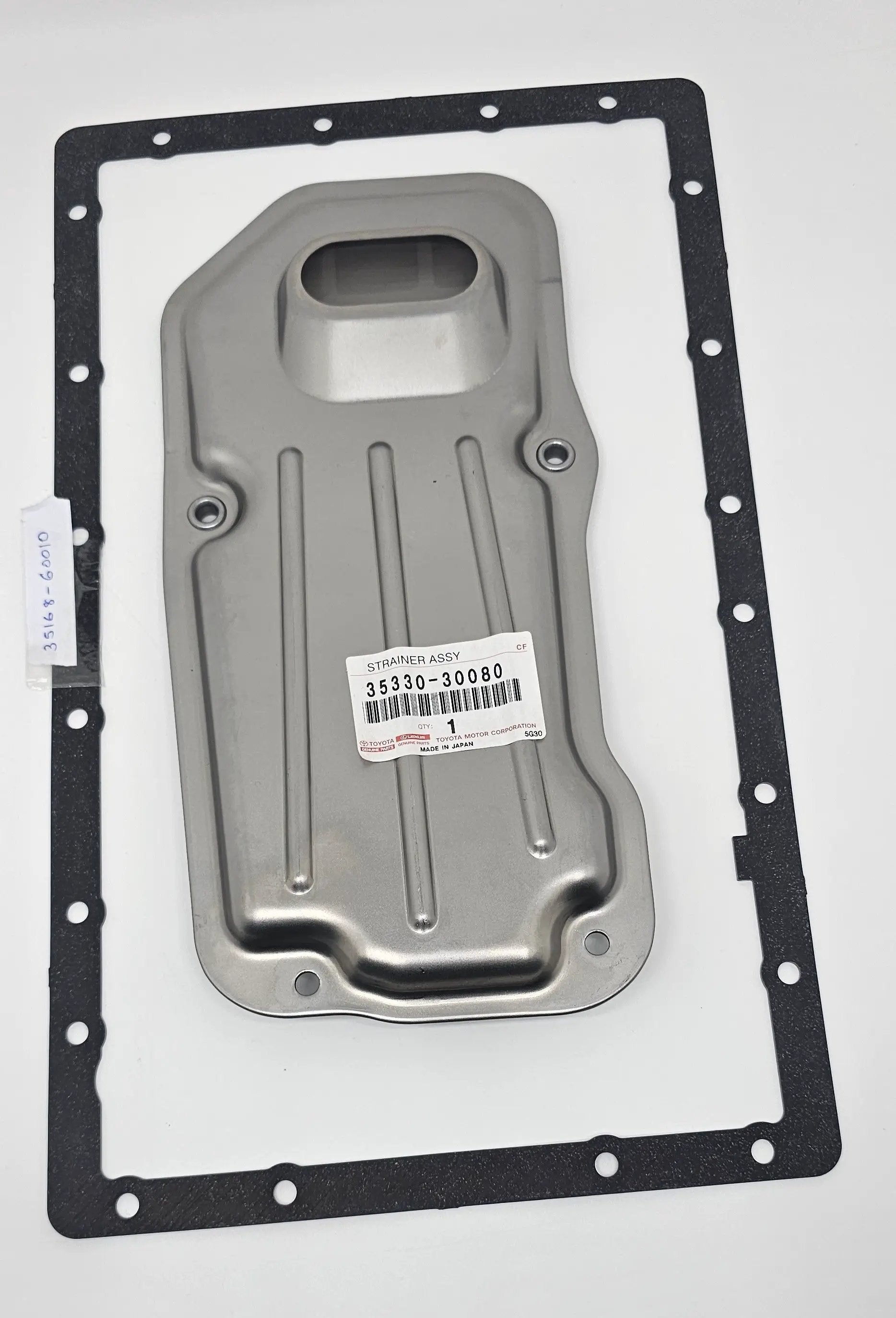Toyota strainer assembly 35330-30080; gray metal housing with black gasket for engine oil circulation