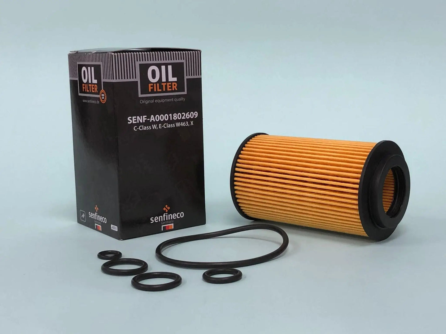 Oil filter SEN A0001802609 for Mercedes; orange pleated cartridge with black box and O-rings.