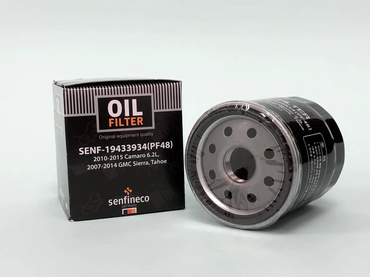 Oil filters (2) by Senfineco; black box labeled OIL FILTER PF48 beside a grey metal canister